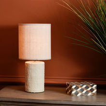 Load image into Gallery viewer, Showcasing a cylindrical base and a drum shade, this cream table lamp is elegant and versatile. The textured porcelain base is reminiscent of woven fabric and complements the plain cream shade perfectly, part of Studio Electric homeware range.
